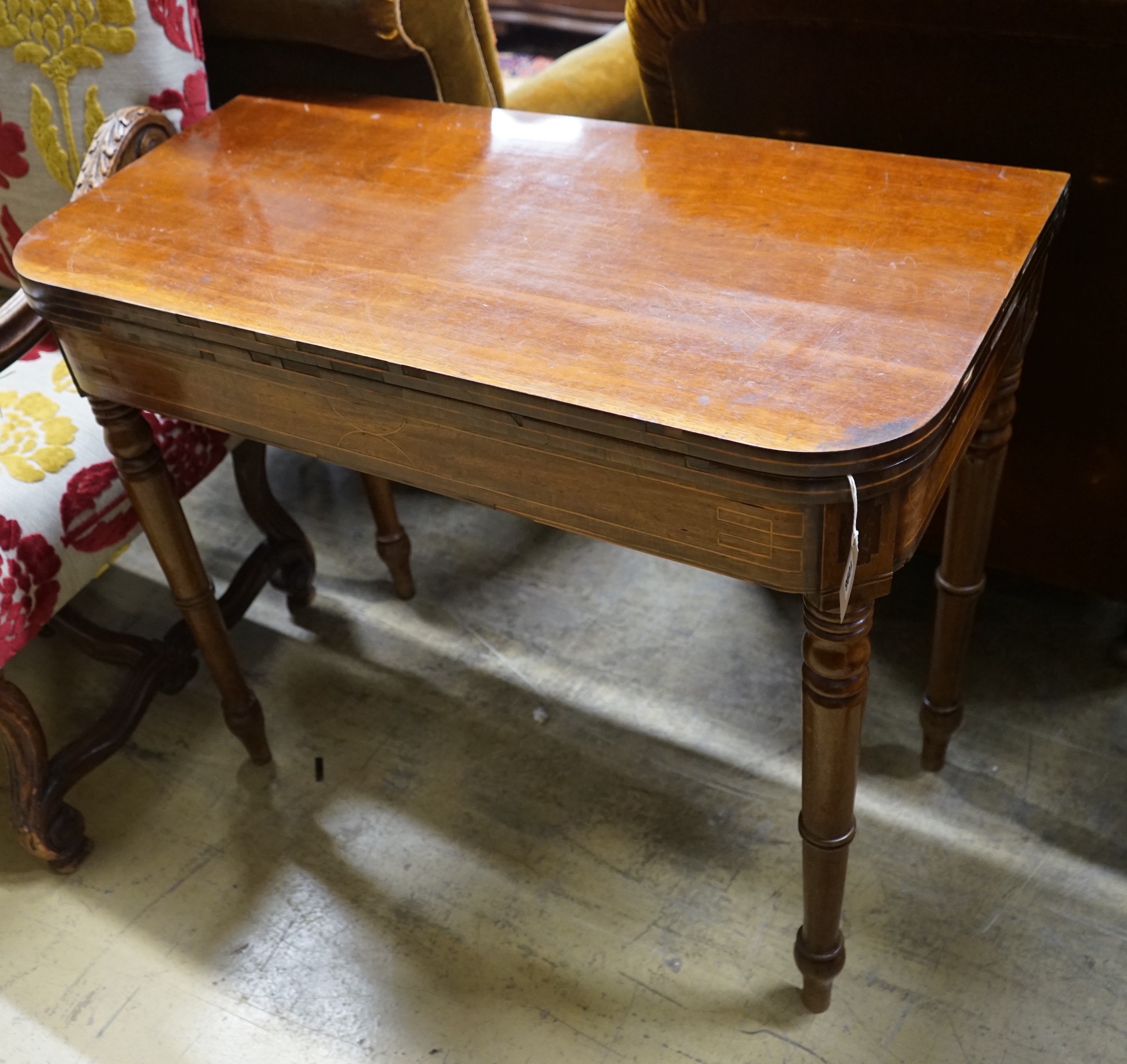 A Regency mahogany folding tea table, width 92cm, depth 45cm, height 78cm